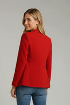 Back view of a red tailored blazer showing the fitted silhouette and centre seam