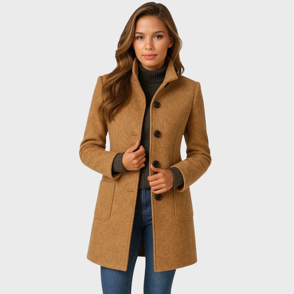 Woman in a camel wool-blend coat with stand collar, button front and patch pockets, worn open over a brown polo neck