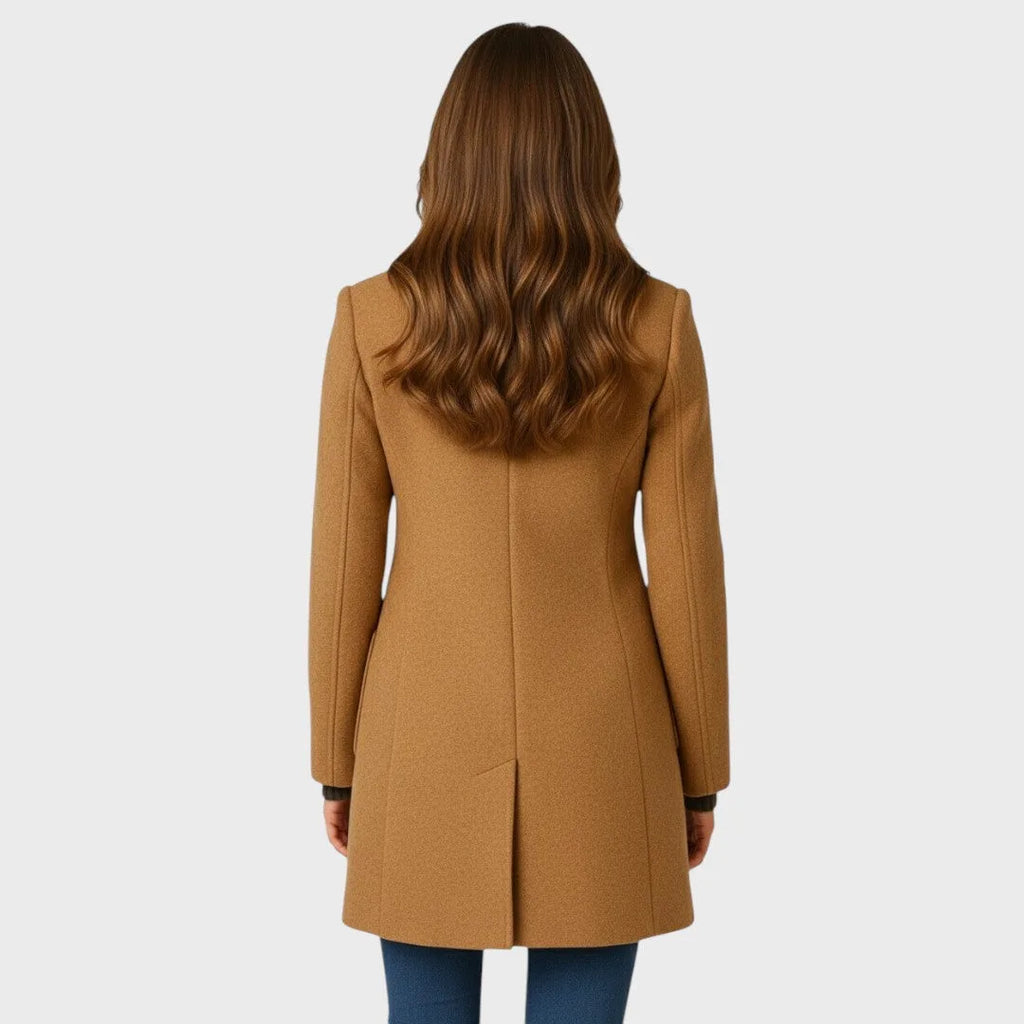 Back view of the camel wool coat showing tailored seaming, fitted waist and a centre back vent