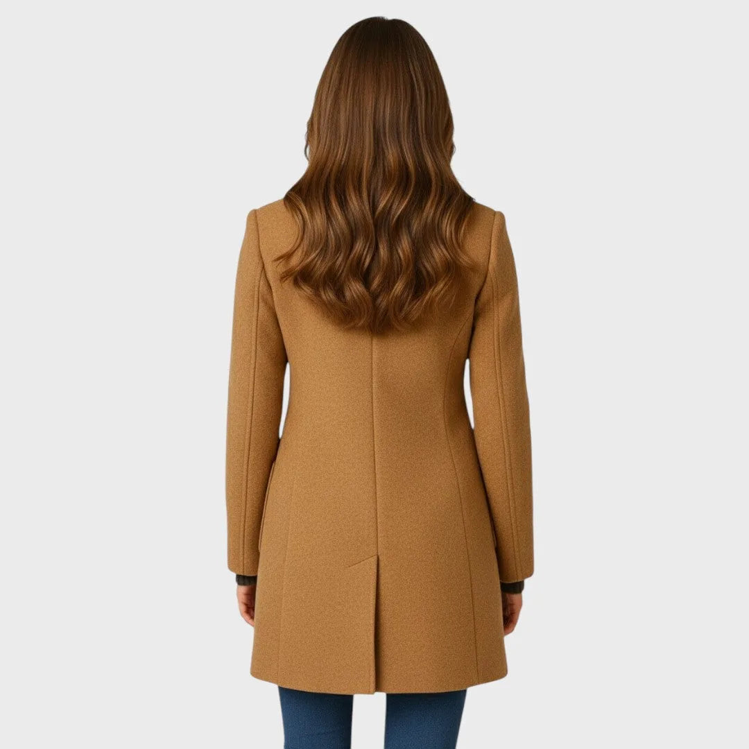 Back view of the camel wool coat showing tailored seaming, fitted waist and a centre back vent