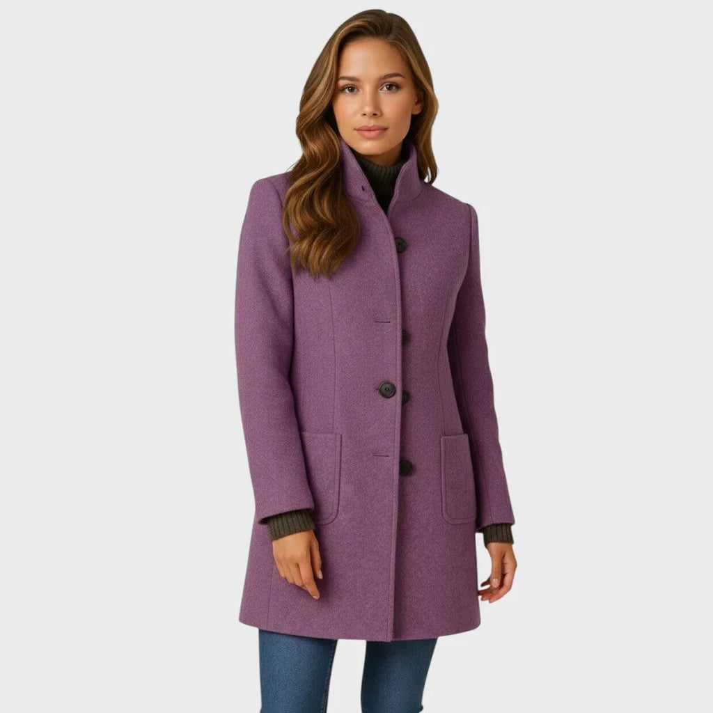 Mauve purple wool coat with stand collar and patch pockets, worn open over a brown ribbed knit