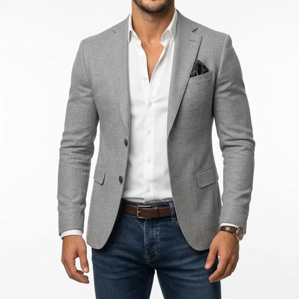 Grey woven tailored blazer worn open over a white shirt, showing textured fabric and notch lapel detail