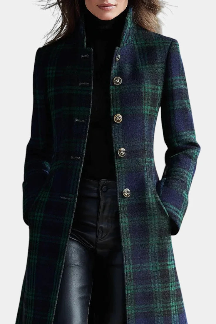 Close-up of the stand collar, ornate metal buttons and tartan pattern on the coat's bodice