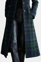 Detail shot of the coat's open front, hand pocket and button placket in green and navy check