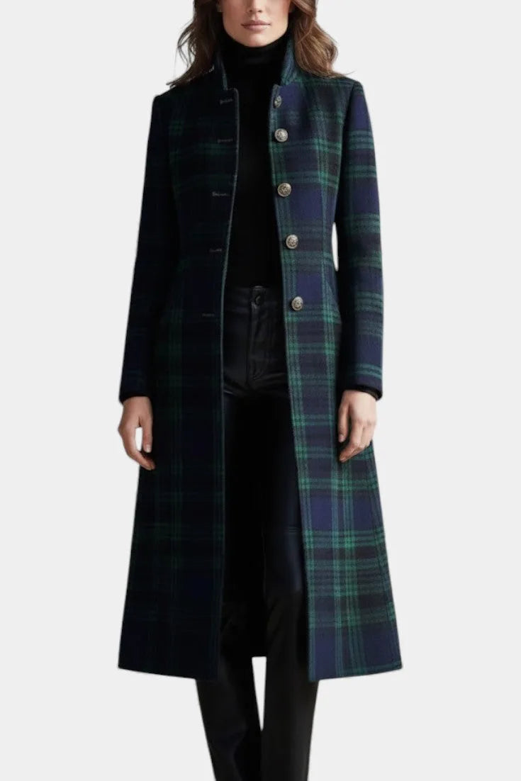 Three-quarter view of the tartan coat worn open over black trousers, showing the A-line hem