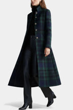 Side view of a woman walking in the full-length checked coat, showing the swishing flared skirt