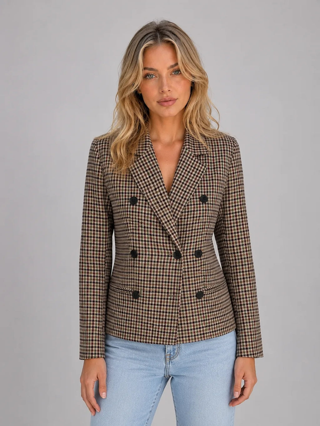 Front view of a taupe checked double-breasted blazer worn open over jeans, showing lapel collar and button detail