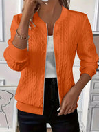 Orange cable knit-textured bomber jacket worn open, front view showing full zip and ribbed trims