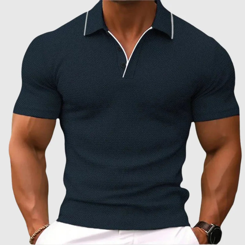 Front view of a dark navy textured knit polo shirt with contrast white collar piping