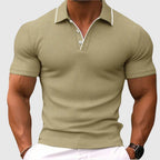 Close-up of a khaki textured knit polo shirt showing the white trim detail along the collar edge