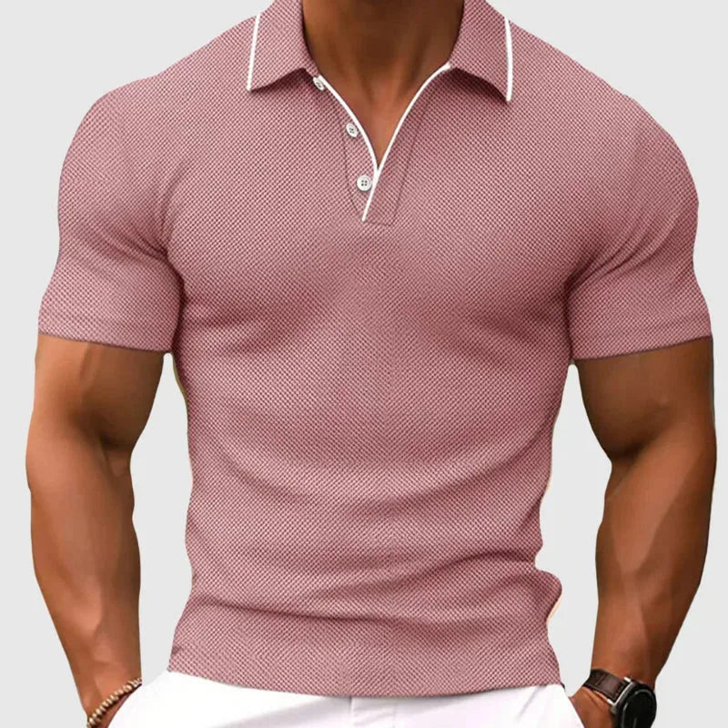 Pink textured knit polo shirt worn with white trousers, showing fitted sleeve and chest detail