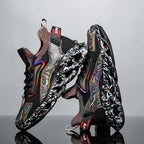Side view of black textured-print trainers with rainbow-striped collar and sculpted, cut-out sole unit