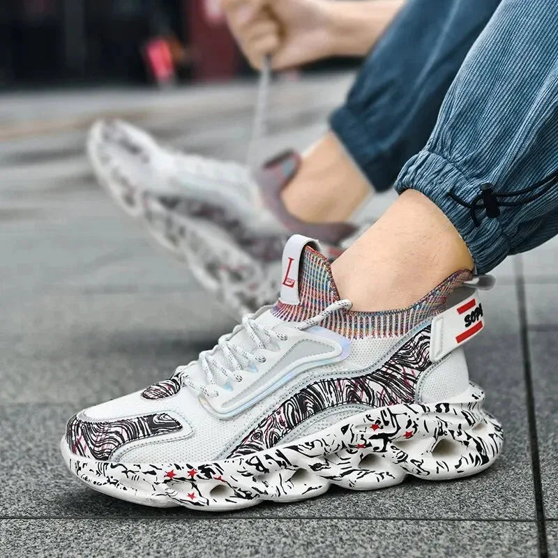 On-foot view of a white patterned trainer being laced up on a city pavement