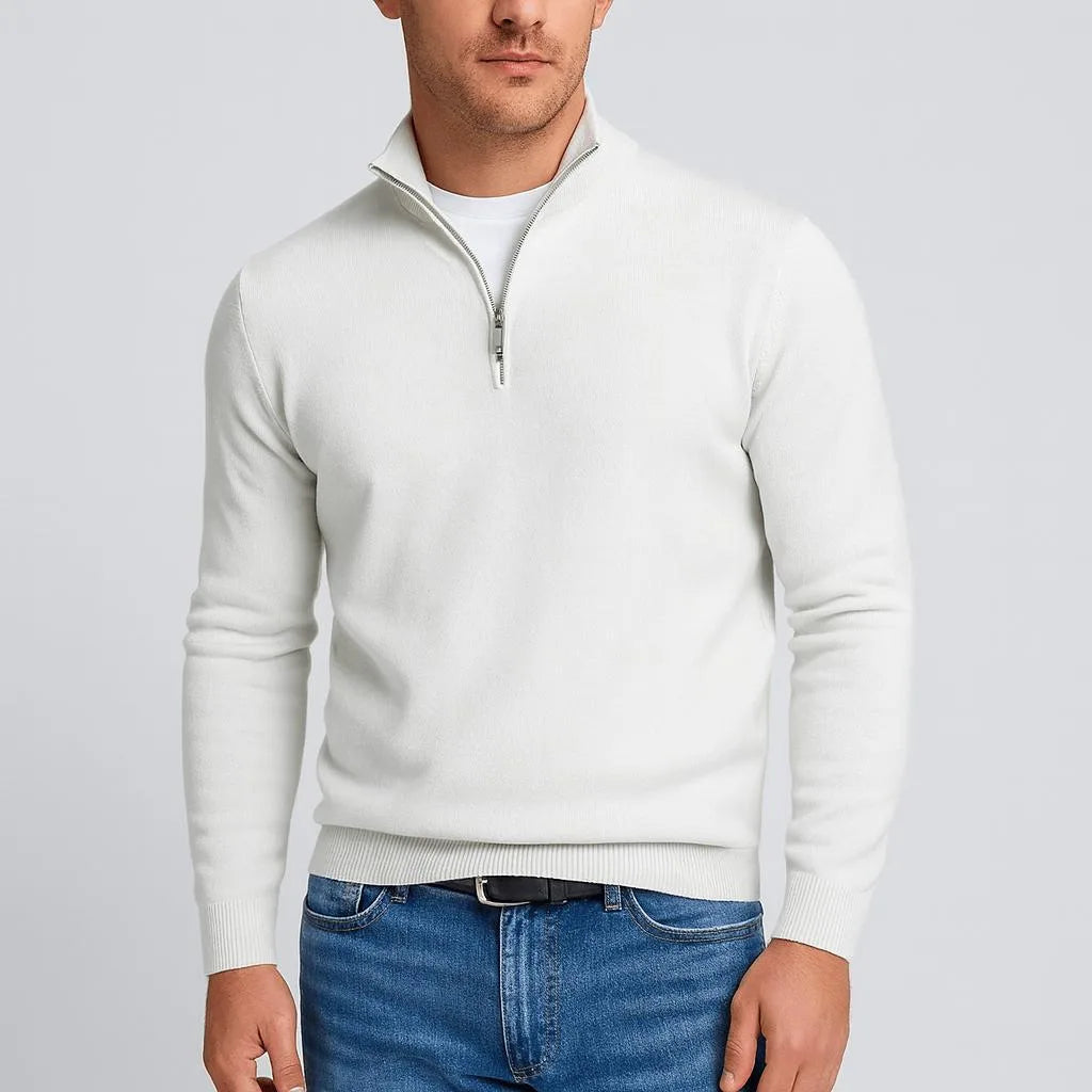 Off-white quarter-zip jumper with silver zip pull, shown unzipped at the neckline over a white t-shirt