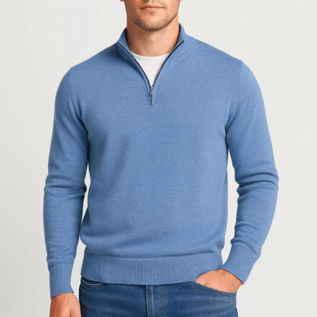 Soft blue heather quarter-zip jumper with hands tucked into denim trouser pockets