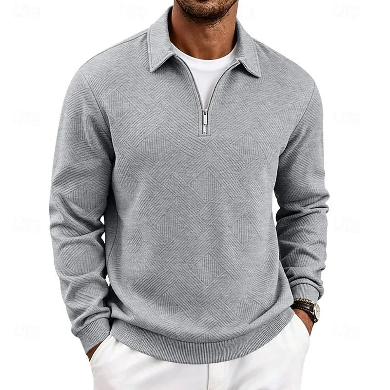 Light grey textured quarter-zip pullover worn with white trousers, front view showing collar and zip