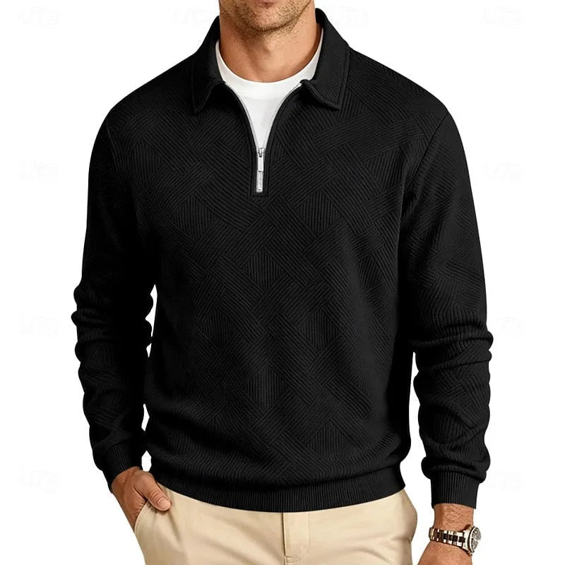 Black textured quarter-zip pullover with silver zip detail, front view with hand in pocket
