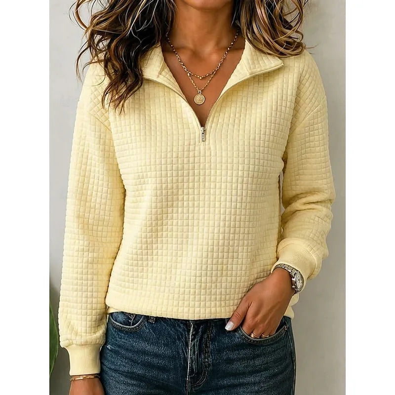 Front view showing the relaxed fit and long sleeves of the textured quarter-zip pullover