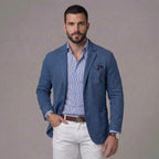 Blue textured blazer shown against a grey backdrop, paired with a blue striped shirt and leather belt
