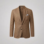 Flat lay front view of the brown textured blazer with a pocket square in the welt pocket