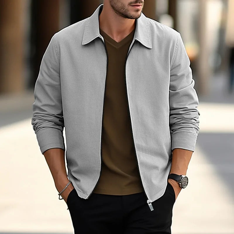 Grey textured overshirt with front zip and collar, worn open showing waffle-textured fabric close up