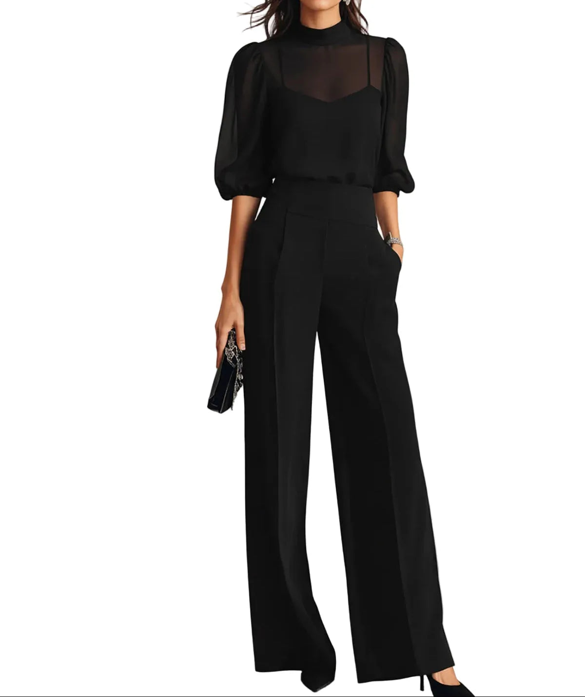 Woman wearing a black three-piece set with sheer mock-neck blouse, pleated wide-leg trousers and pointed heels
