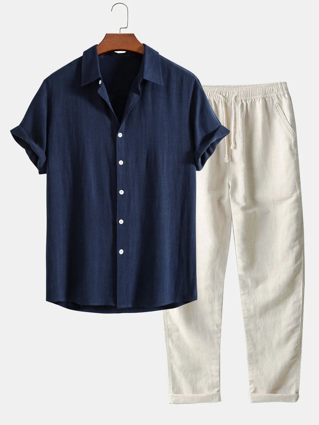 Navy blue linen-look shirt paired with cream drawstring trousers, close view of collar and cuffs