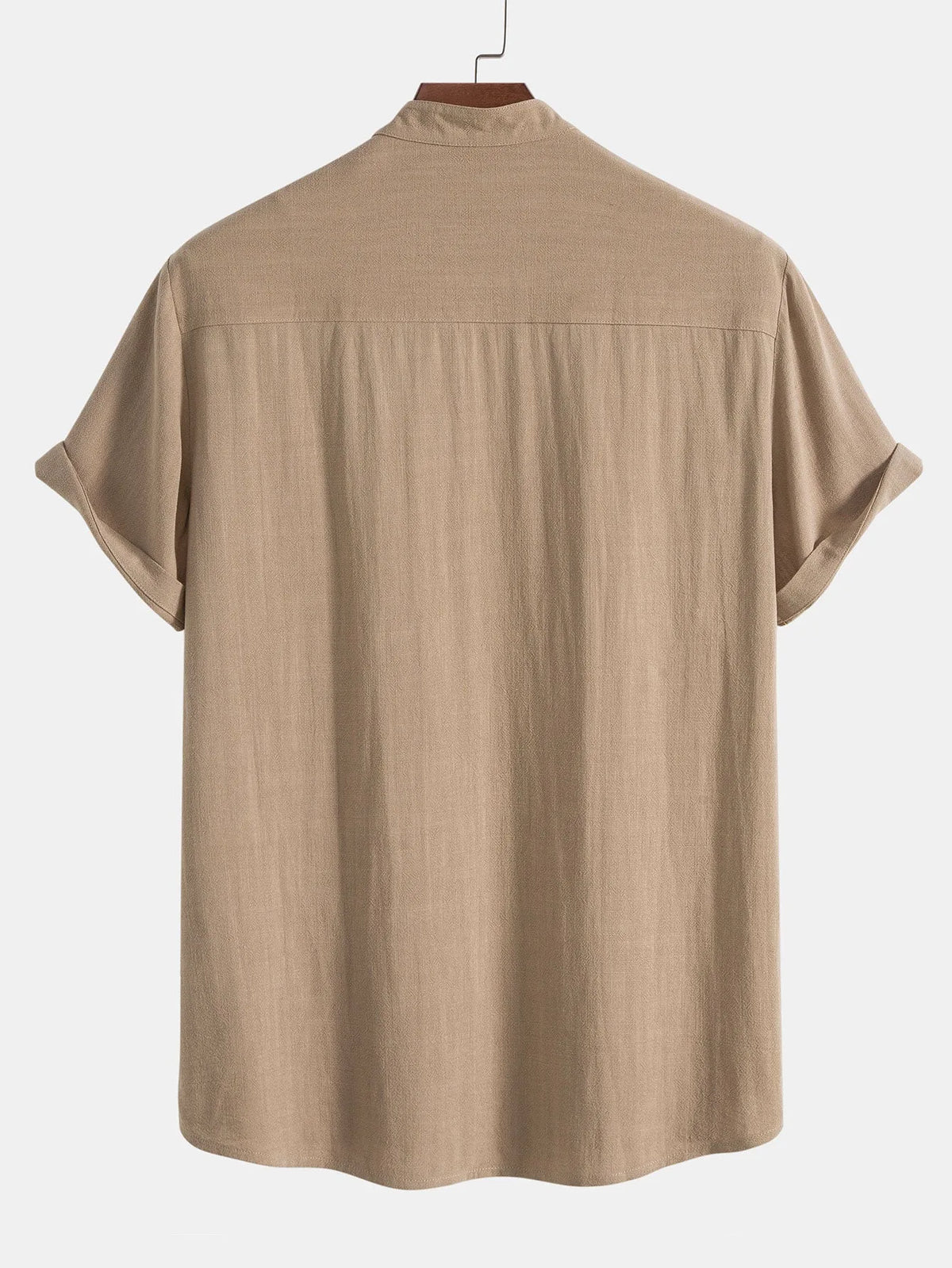 Reverse view of beige stand-collar shirt showing back yoke and rolled sleeve cuffs