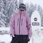 Front view of a mauve pink ski jacket with adjustable hood, zip pockets and drawstring hem in falling snow