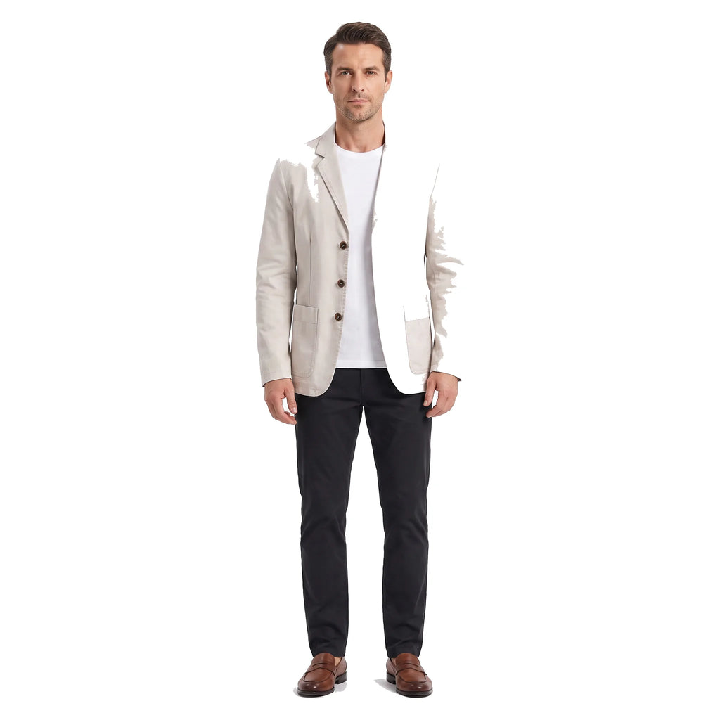 Man wearing the beige cotton blazer open over a white t-shirt with dark trousers and brown loafers
