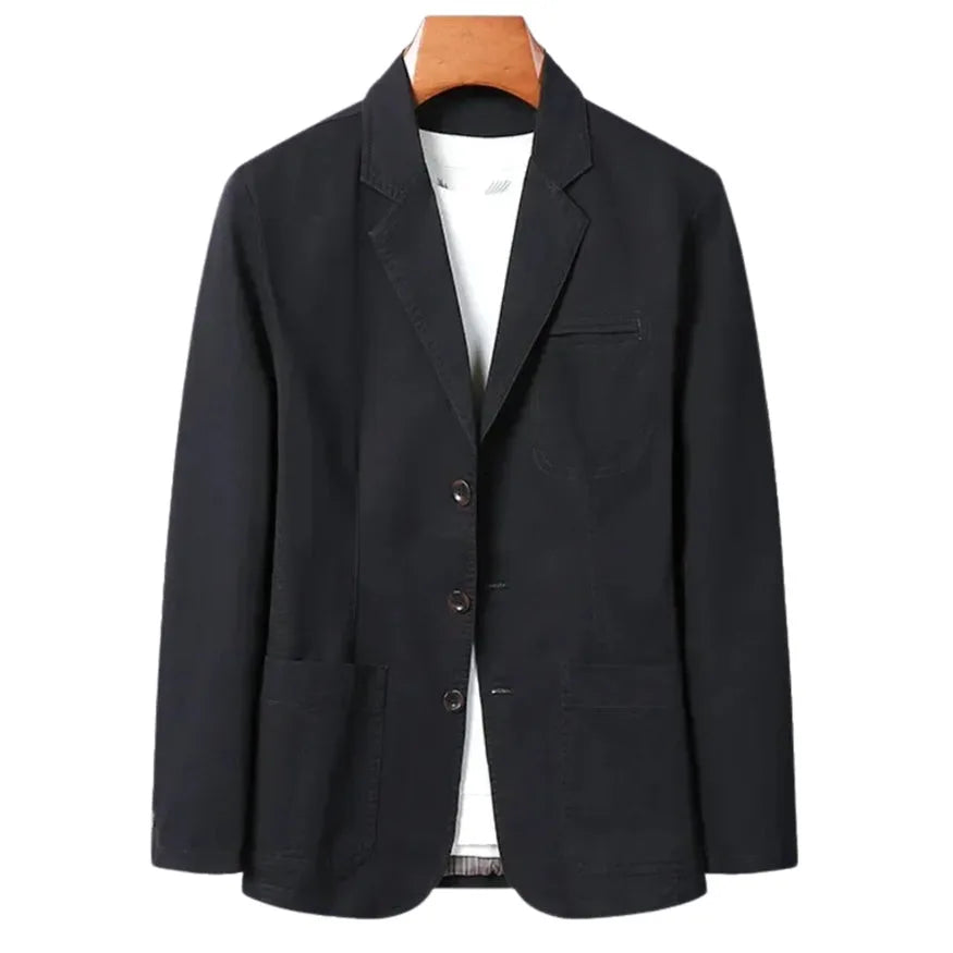 Black cotton blazer on a wooden hanger, front view showing patch pockets and button front