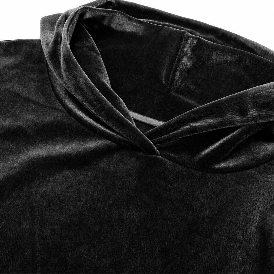 Flat lay close-up of the velour hood fabric showing its soft plush texture and drawstring-free construction