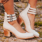 Cream leather ankle strap heels showing triple buckle straps, rear zip and block heel detail