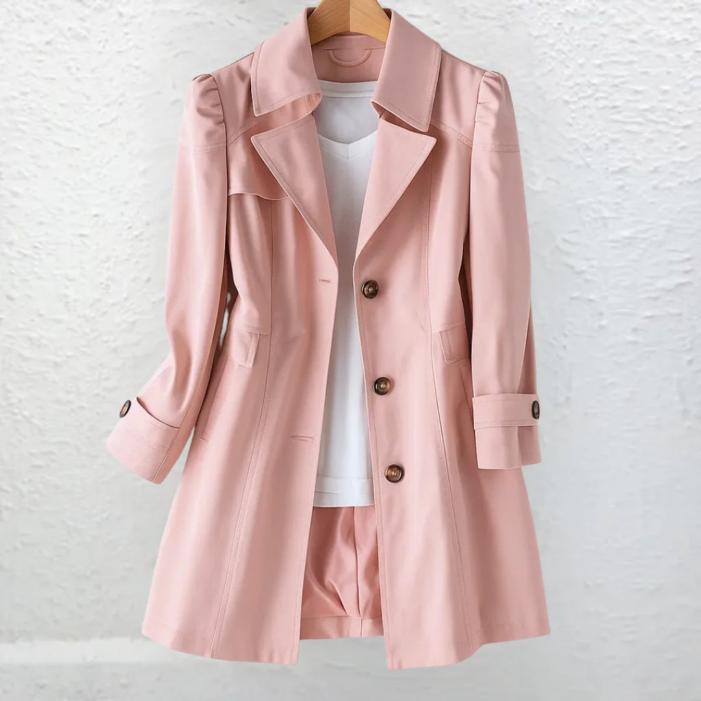 Pink trench-style coat with notch collar and button front, worn open over a white top