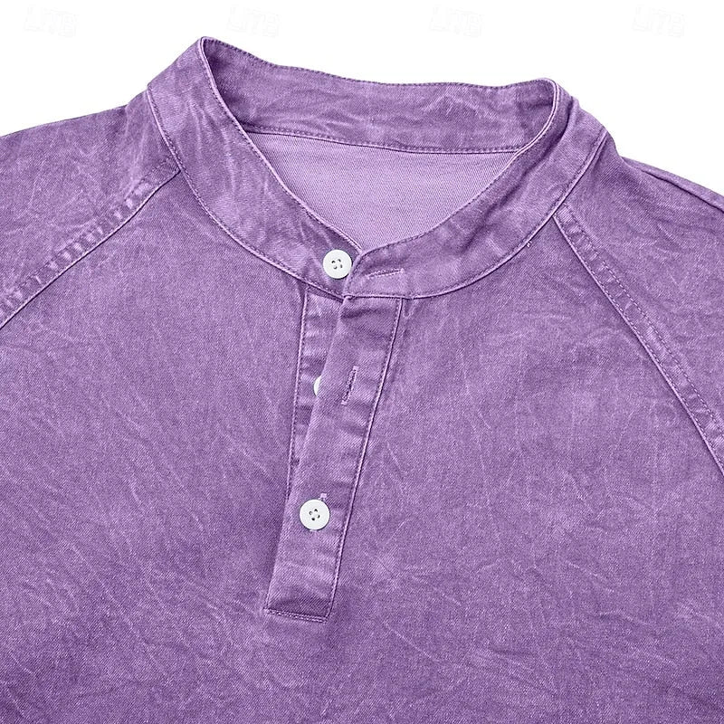 Close-up of the standing collar and two-button placket detail on a purple washed cotton henley shirt