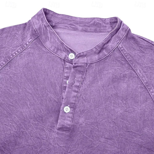 Close-up of the standing collar and two-button placket detail on a purple washed cotton henley shirt