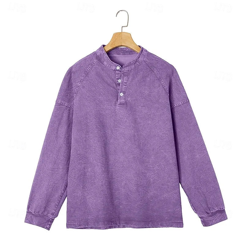 Front view of a purple washed henley shirt displayed on a wooden hanger