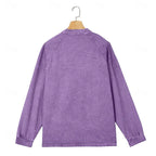 Back view of a purple washed henley shirt displayed on a wooden hanger showing raglan sleeves
