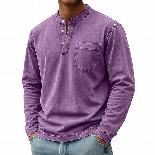 Man wearing a purple washed henley shirt with buttoned placket and chest pocket, front angled view