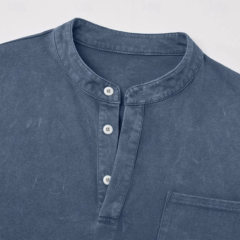Side angled view of the green henley shirt showing sleeve seam and dropped shoulder