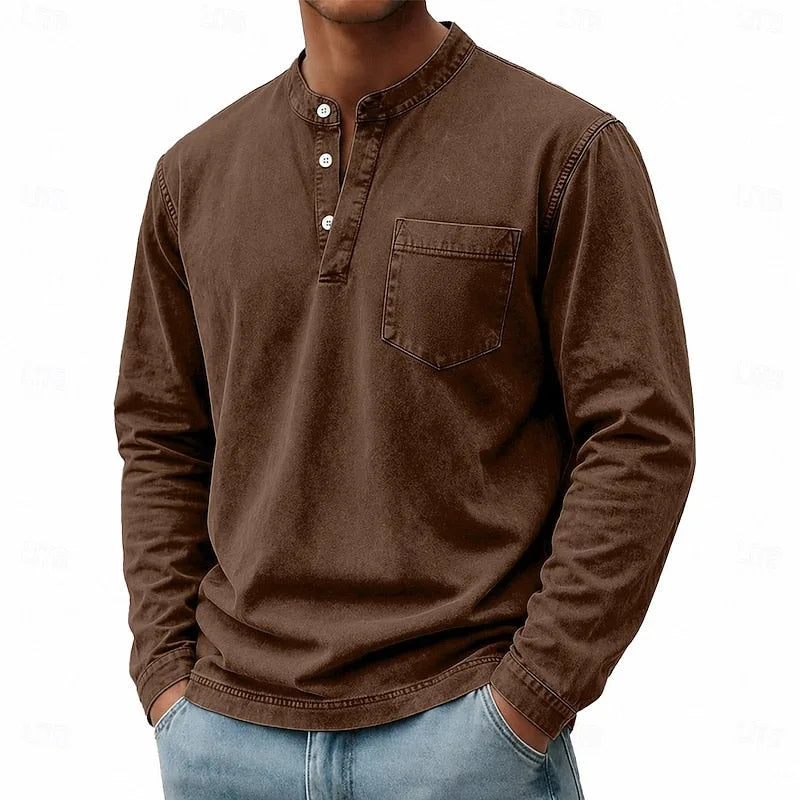Close-up view of the green henley shirt's button placket and collar stand