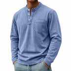Close-up front view of a light blue washed henley shirt showing button placket and stand collar