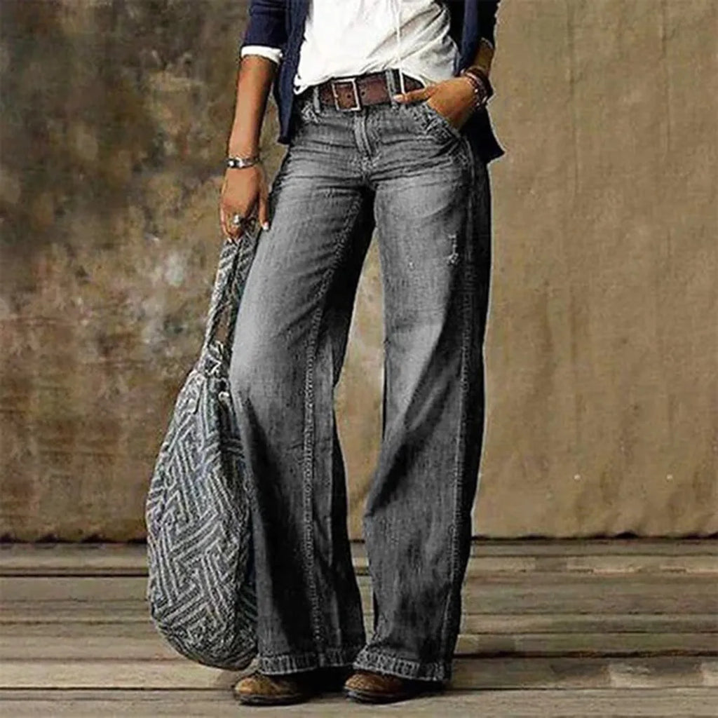 Grey wash version of the wide-leg jeans worn with a woven shoulder bag and cropped blazer