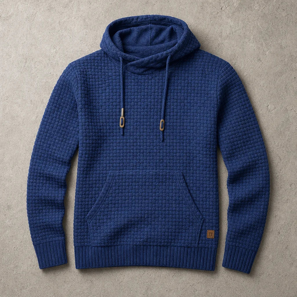 Navy blue waffle-knit pullover hoodie with front pocket, ribbed trims and metal drawstring tips