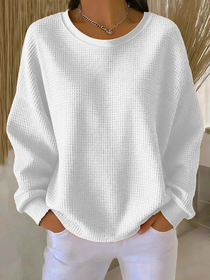 White waffle-texture jumper with dropped shoulder seams and round ribbed collar, front view