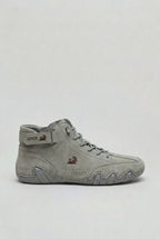 Side view of the same boot style in light grey suede with a burgundy ram logo on the tongue
