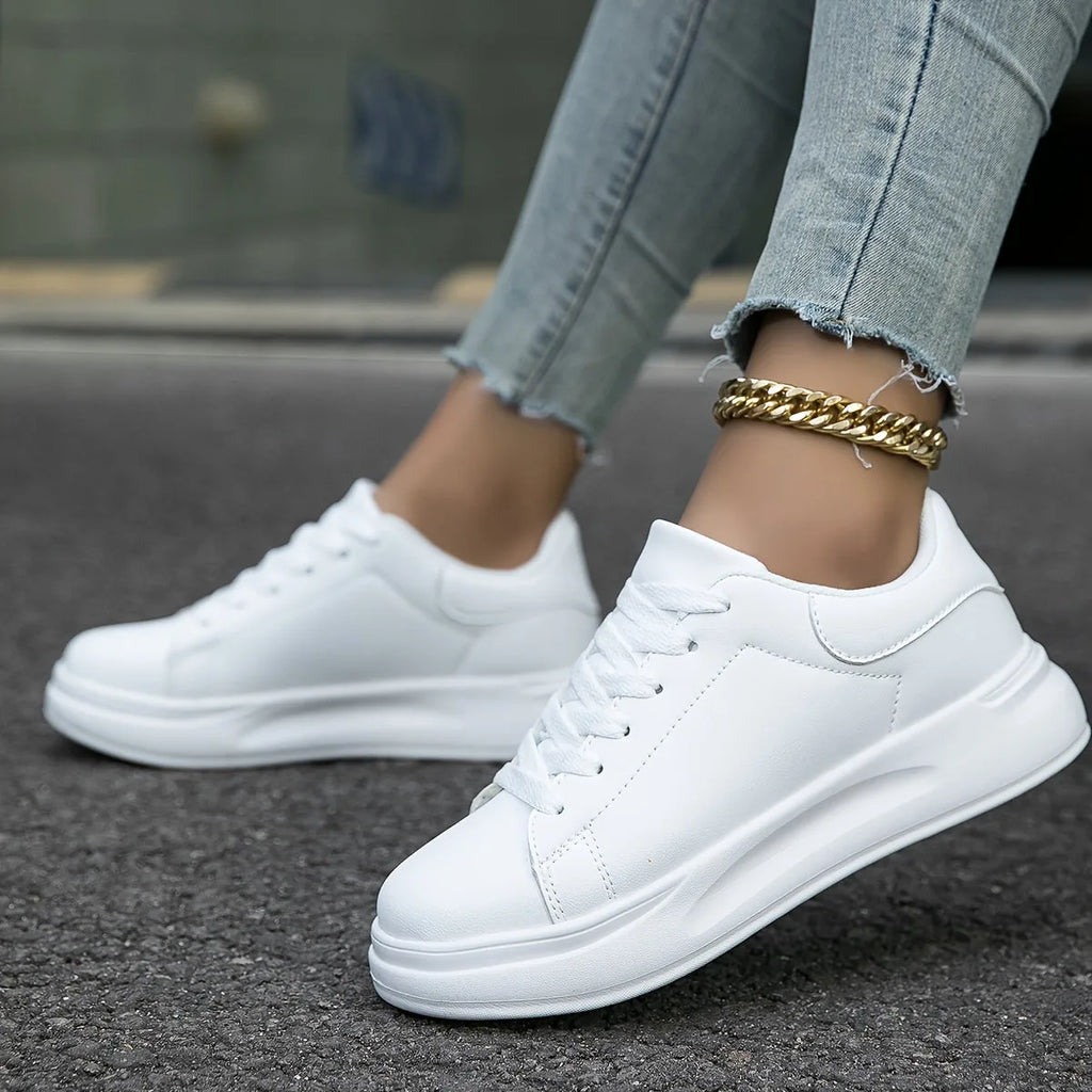 Close-up back view of all-white trainer heel and thick platform sole
