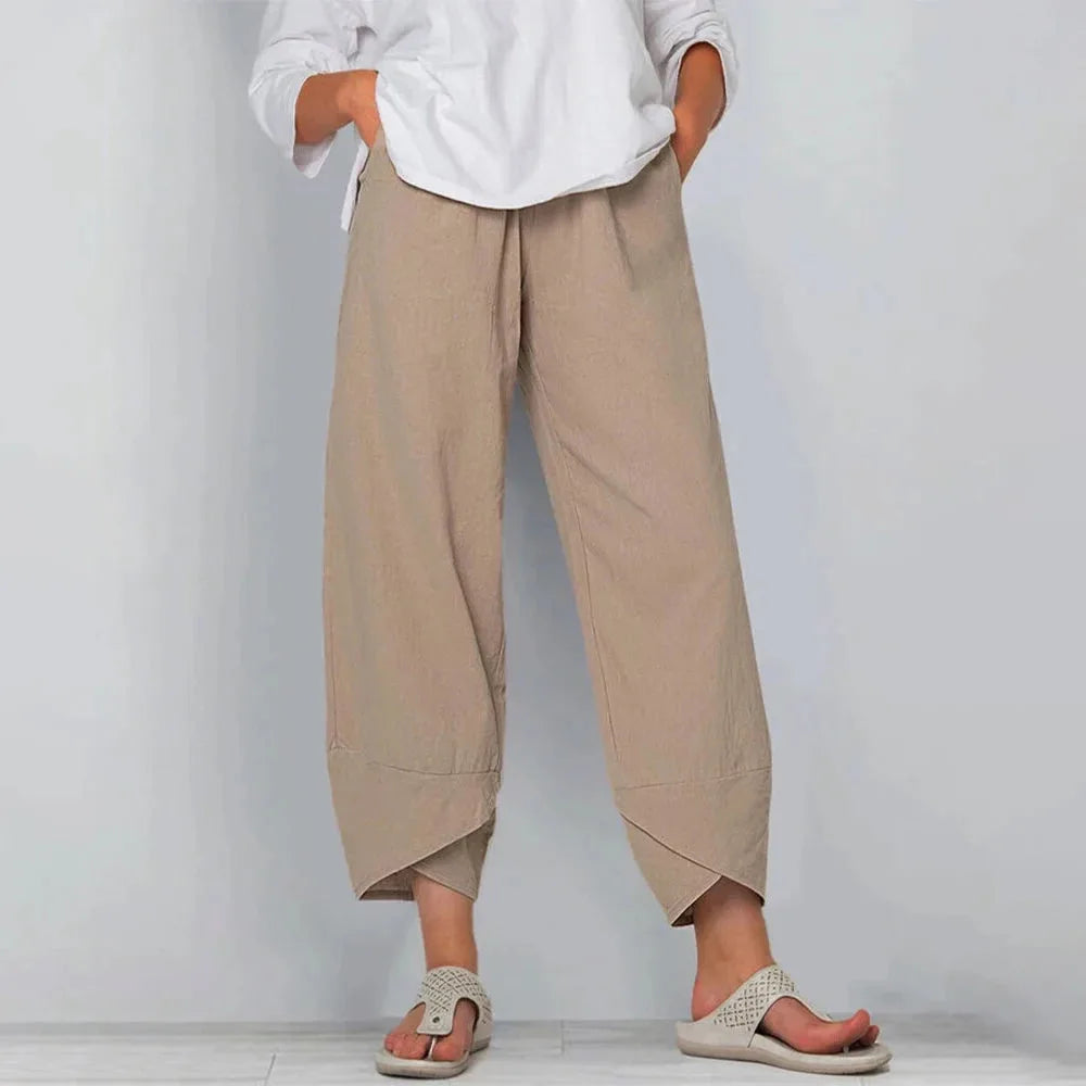 Front view of khaki wide-leg linen-blend trousers with elasticated waist and asymmetric curved hem