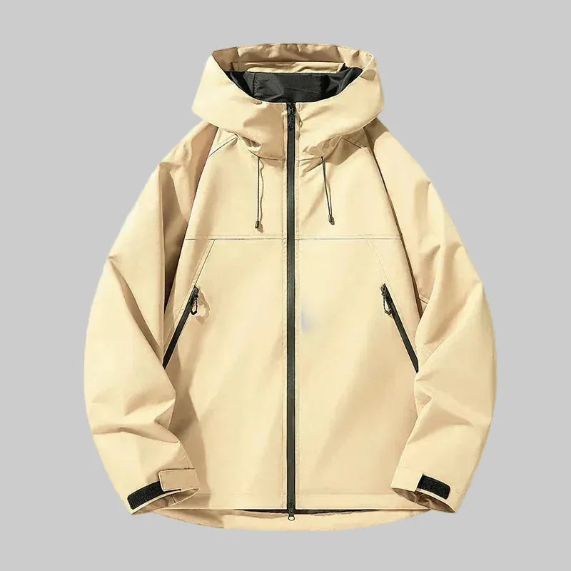 Beige hooded jacket, front view, showing relaxed boxy fit, zip pockets and adjustable hood toggles