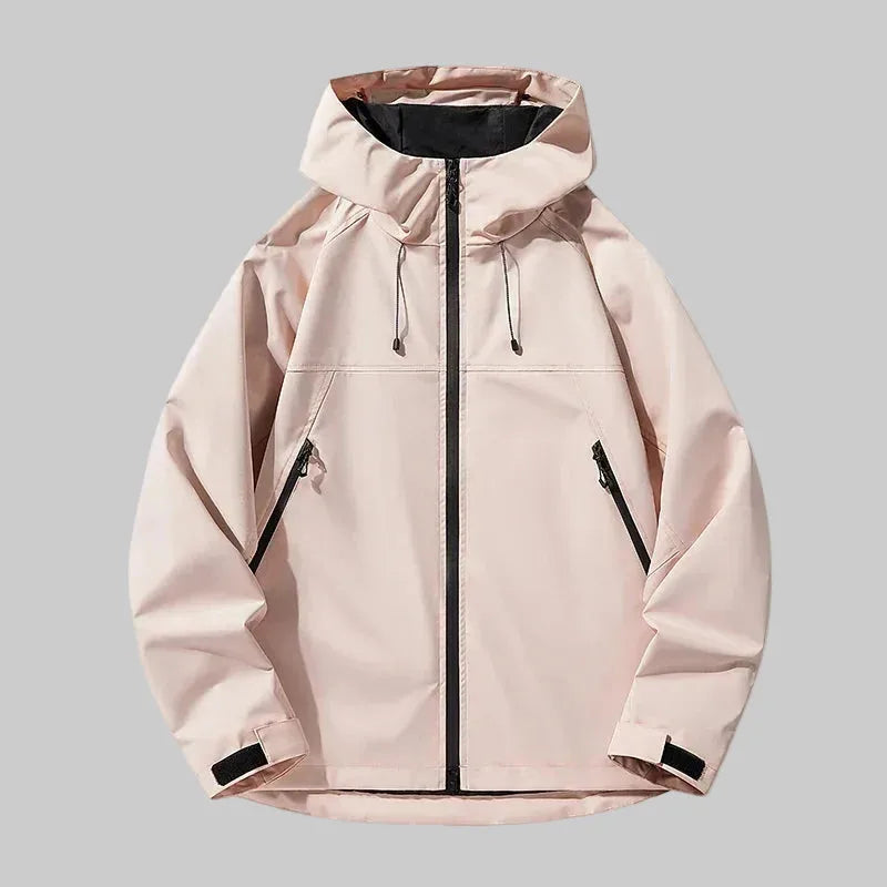 Pale pink hooded jacket, front view, showing lightweight shell fabric and contrast black zip details